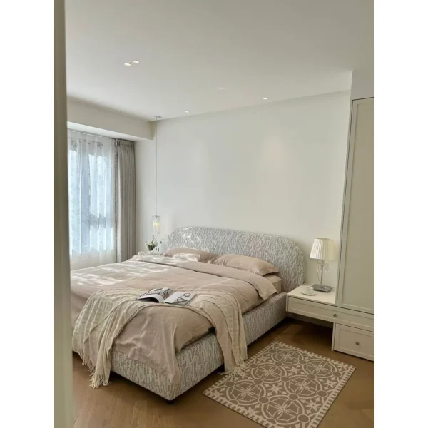 Curved Cotton-Linen Bed with Inset Mattress Frame in sand — in a room setting