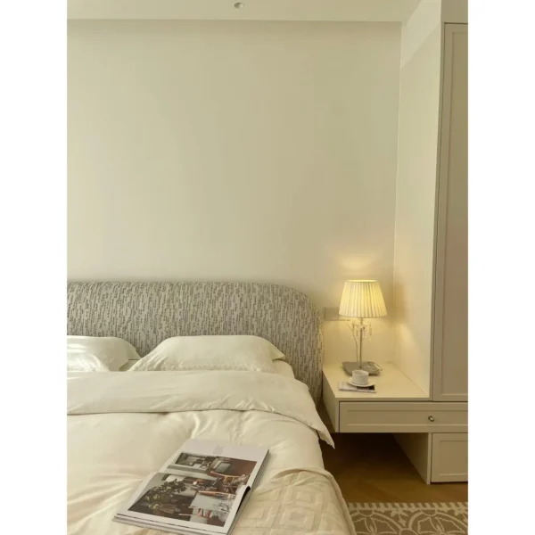 Curved Cotton-Linen Bed with Inset Mattress Frame in sand — in a room setting