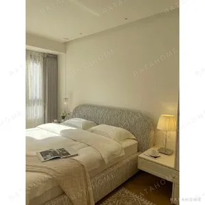 Curved Cotton-Linen Bed with Inset Mattress Frame in sand — in a room setting