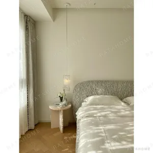 Curved Cotton-Linen Bed with Inset Mattress Frame in sand — in a room setting