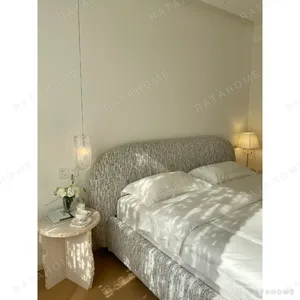 Curved Cotton-Linen Bed with Inset Mattress Frame in sand — in a room setting