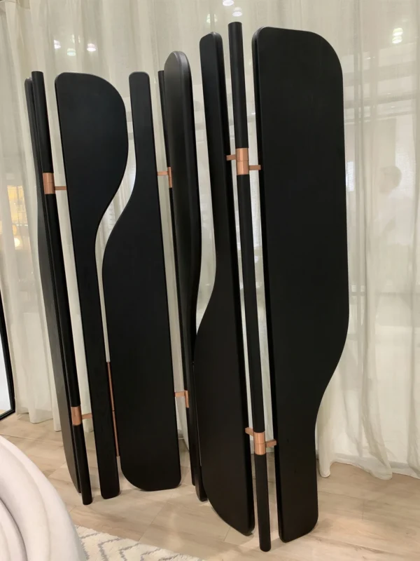 Curved Fan Panel Folding Screen in Black Wood — in a room setting
