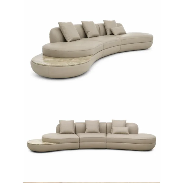 Curved Sofa in Cream Fabric with Natural Stone Side Ledge — in a room setting