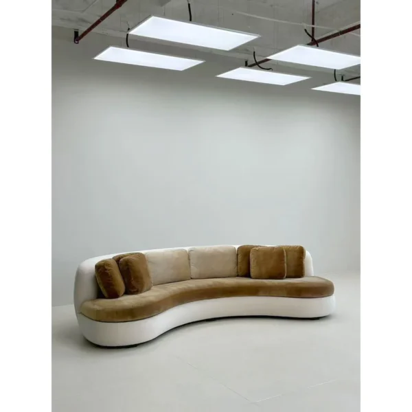 Curved Sofa in Olive Velvet with White Base and Bolster — in a room setting