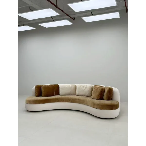 Curved Sofa in Olive Velvet with White Base and Bolster — in a room setting