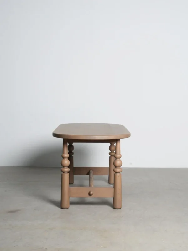 Custom-Colour Oval Oak Table with Turned Legs in natural oak — in a room setting