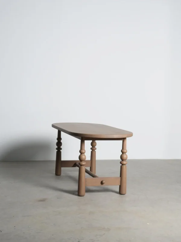 Custom-Colour Oval Oak Table with Turned Legs in natural oak — in a room setting