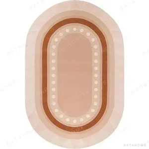 Custom Oval Bordered Rug in Blush and Terracotta with Dots — in a room setting
