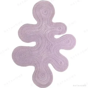 Custom Lilac Splash Rug with Contour Relief in plum — in a room setting