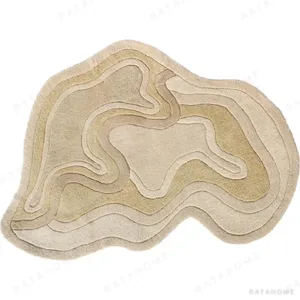 Custom Sand Contour Relief Rug with Irregular Edge in sand — in a room setting