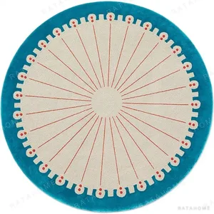 Custom Dotted Edge Round Rug in Cream, Coral and Teal — in a room setting