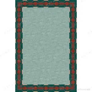 Custom Bordered Rug in Sage with Teal and Red Fret — in a room setting