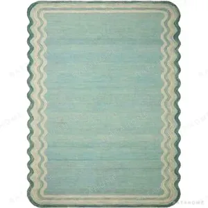 Custom Wavy Edge Rug in Pale Aqua with Line Border — in a room setting