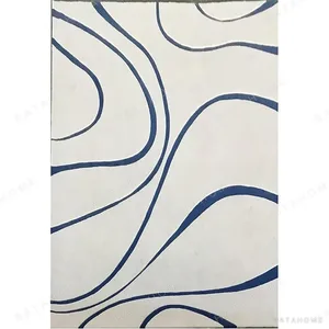 Custom Cream Rug with Flowing Navy Contour Lines in oatmeal — in a room setting