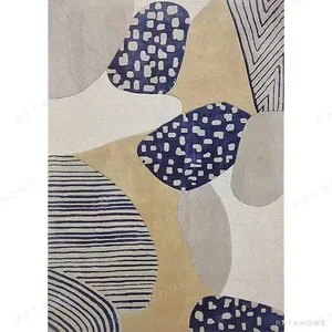 Custom Pebble Collage Rug in Sand, Grey and Navy Patterns — in a room setting