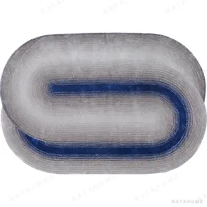 Custom Oval Track Rug in Grey with Navy Core — in a room setting