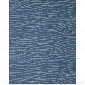 Custom Blue Wood Grain Rug in blue — in a room setting