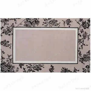 Custom Chinoiserie Border Rug in Taupe and Black — in a room setting