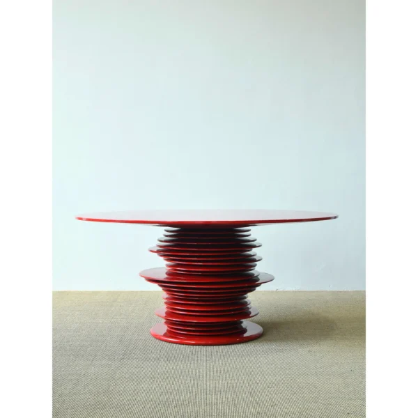 Red High-Gloss Stacked-Disc Round Table in red — in a room setting