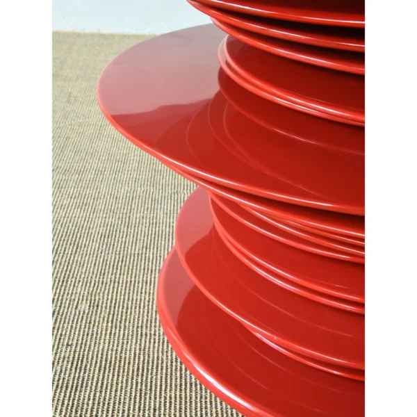 Red High-Gloss Stacked-Disc Round Table in red — in a room setting