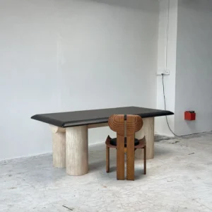 Black Bevelled Wood Table on Travertine Cylinder Base in black — front view
