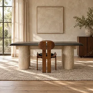 Black Bevelled Wood Table on Travertine Cylinder Base in black — in a room setting