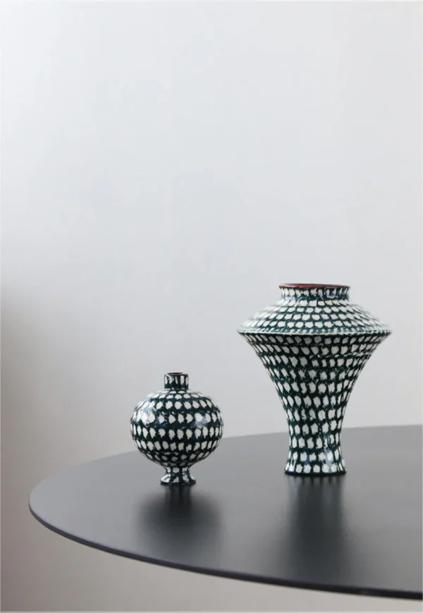 Artist-Made Teal Grid Flared Urn Vase in olive — in a room setting