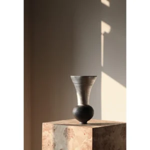 Artist-Made Silver Lustre Sphere Vase in black — in a room setting