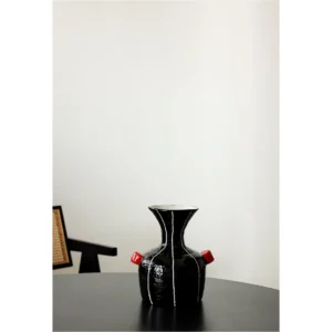 Artist-Made Black Glossy Vase in black — in a room setting