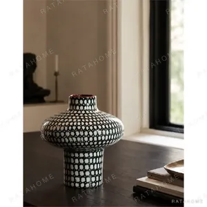 Artist-Made Black and White Grid Mushroom Vase with Red Rim in black — in a room setting