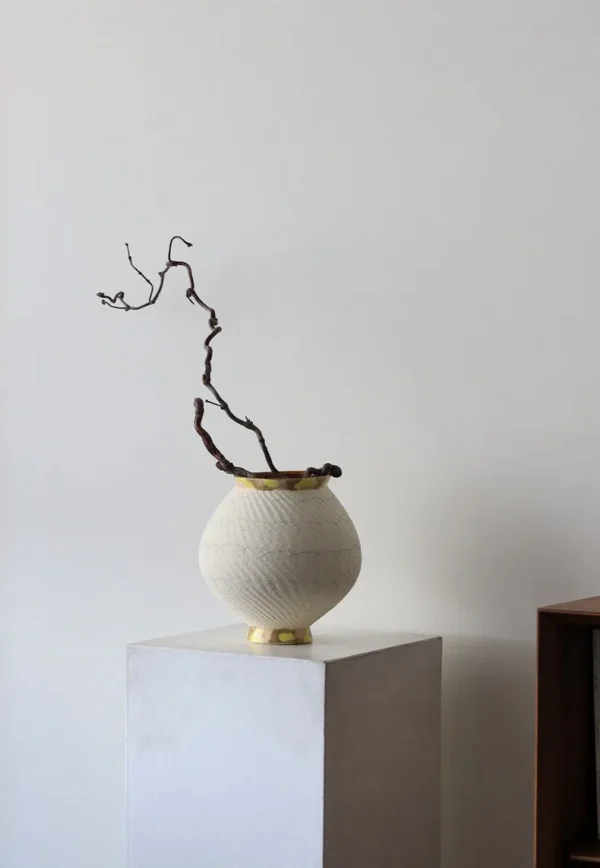 Artist-Made Two-Tone Combed Moon Jar with Gilded Foot in ivory — in a room setting