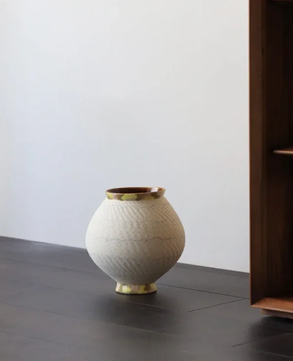 Artist-Made Two-Tone Combed Moon Jar with Gilded Foot in ivory — in a room setting