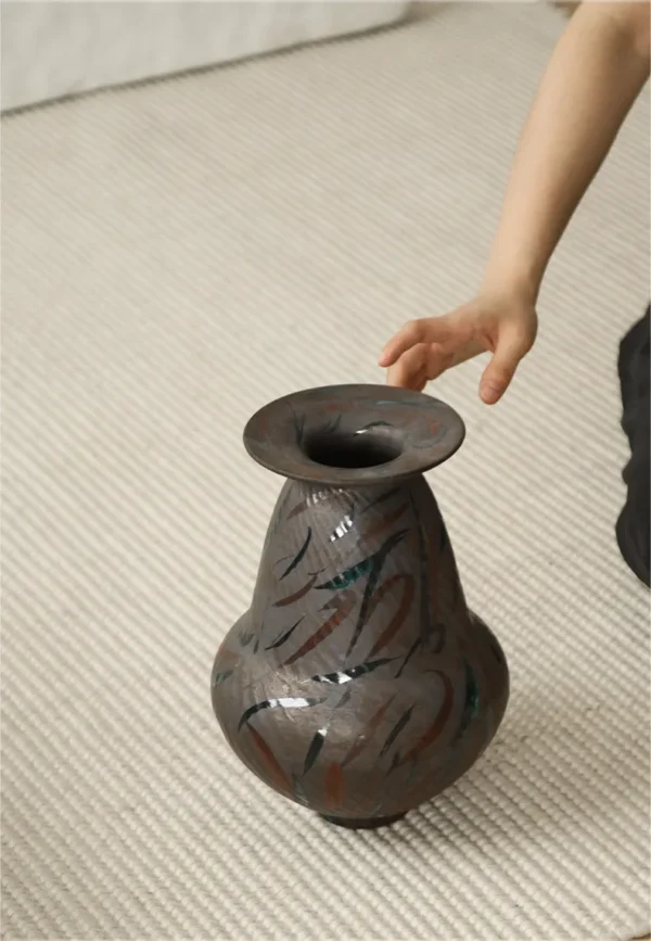 Artist-Made Hand-Painted Line Vase in clay — in a room setting