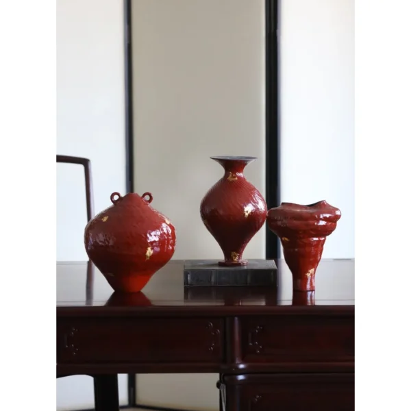 Designer Jingdezhen Red Lacquer-Glaze Vases with Gold Leaf in red — in a room setting