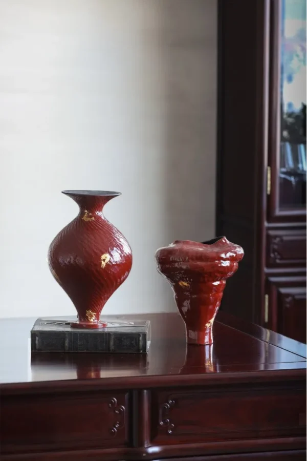 Designer Jingdezhen Red Lacquer-Glaze Vases with Gold Leaf in red — in a room setting