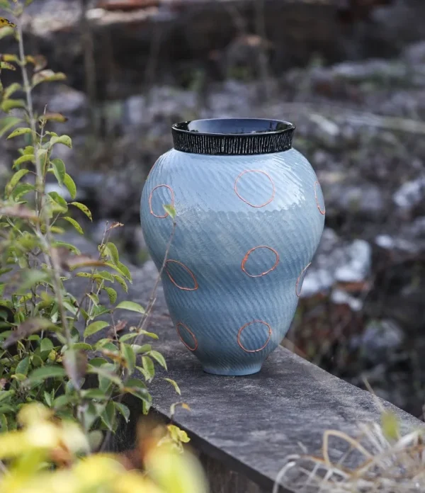 Designer Jingdezhen Glossy Blue Twisted Rib Jar Vase, Large in blue — in a room setting