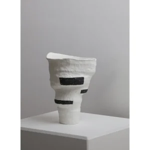 Designer Jingdezhen White Folded Vase with Black Spots in ivory — in a room setting