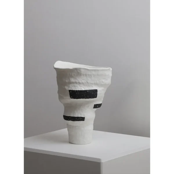 Designer Jingdezhen White Folded Vase with Black Spots in ivory — in a room setting