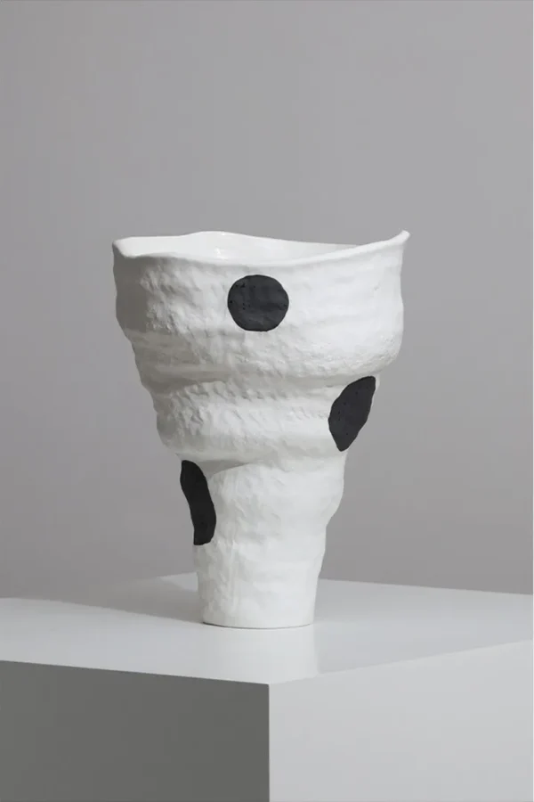 Designer Jingdezhen White Folded Vase with Black Spots in ivory — in a room setting