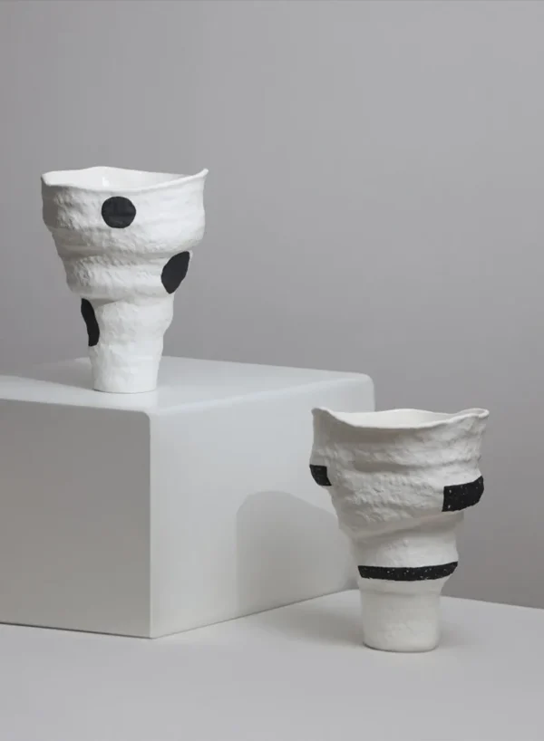 Designer Jingdezhen White Folded Vase with Black Spots in ivory — in a room setting