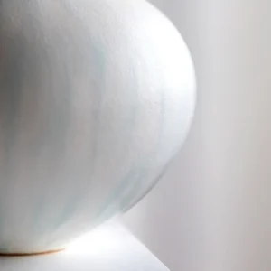 Artist-Made Mist Blue Flow Glaze Long-Neck Vase in ivory — in a room setting