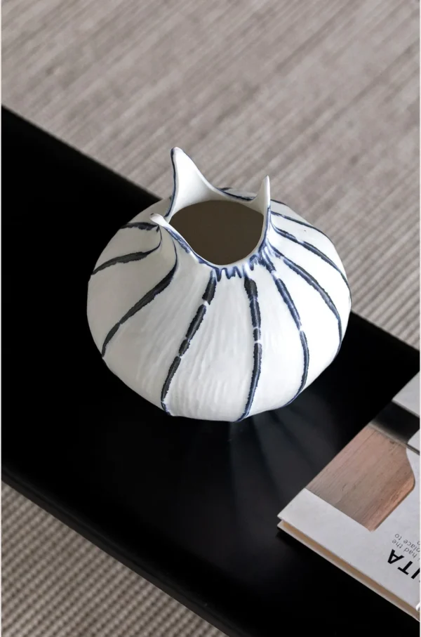 Artist-Made Blue Line Bud Vase with Pointed Petal Rim in ivory — in a room setting