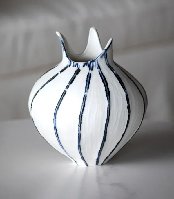Artist-Made Blue Line Bud Vase with Pointed Petal Rim in ivory — in a room setting