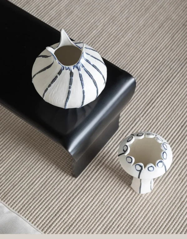Artist-Made Blue Line Bud Vase with Pointed Petal Rim in ivory — in a room setting