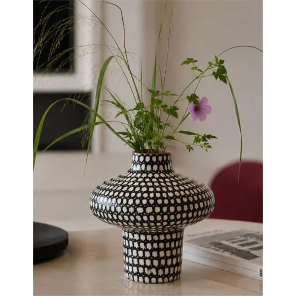 Artist-Made Hand-Painted Grid Mushroom Vase for TV Consoles in black — in a room setting