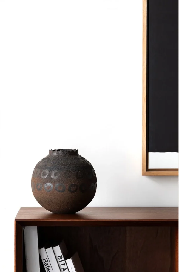 Artist-Made Hand-Painted Terracotta Ring Pattern Round Jar in rust — in a room setting