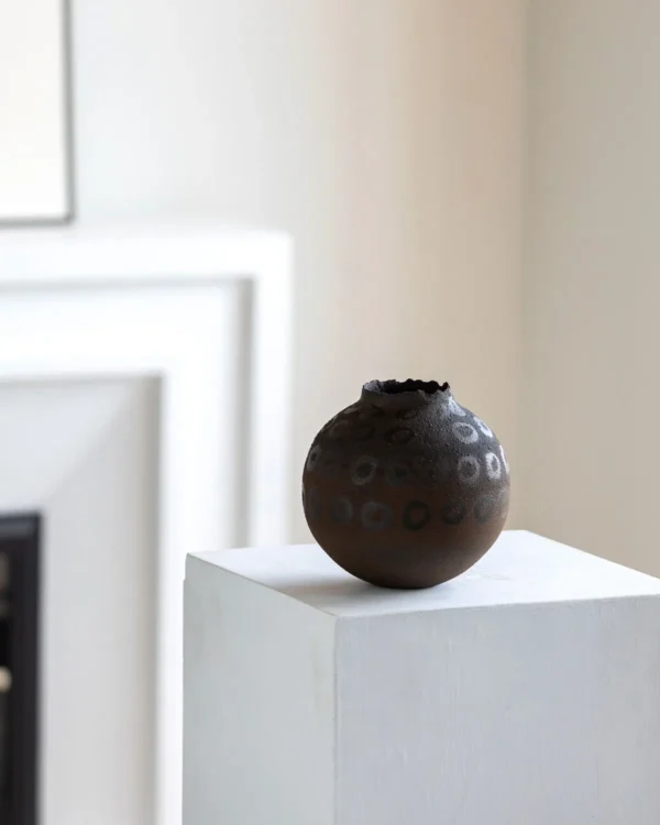 Artist-Made Hand-Painted Terracotta Ring Pattern Round Jar in rust — in a room setting