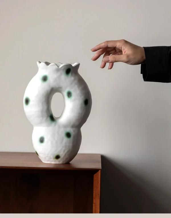 Artist-Made Hand-Pinched Pierced Vase with Green Moss Dots in ivory — in a room setting