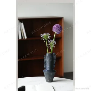 Artist-Made Hand-Pinched Black Stone Sculptural Vase in black — in a room setting
