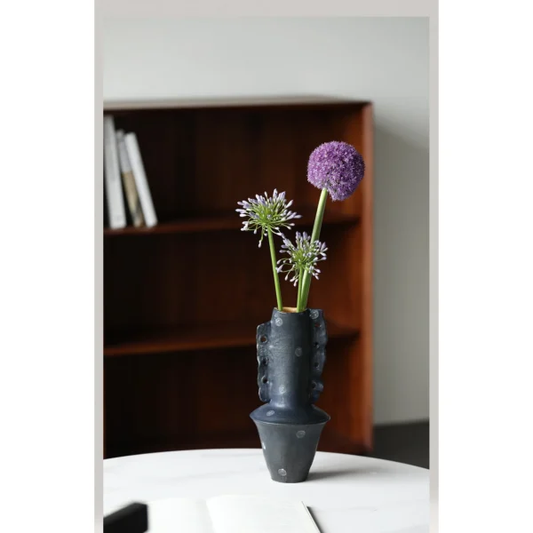Artist-Made Hand-Pinched Black Stone Sculptural Vase in black — in a room setting
